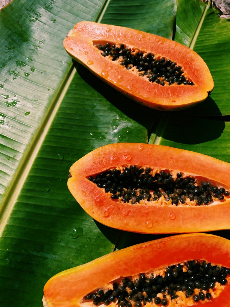 Halved Papayas on Banana Leaves