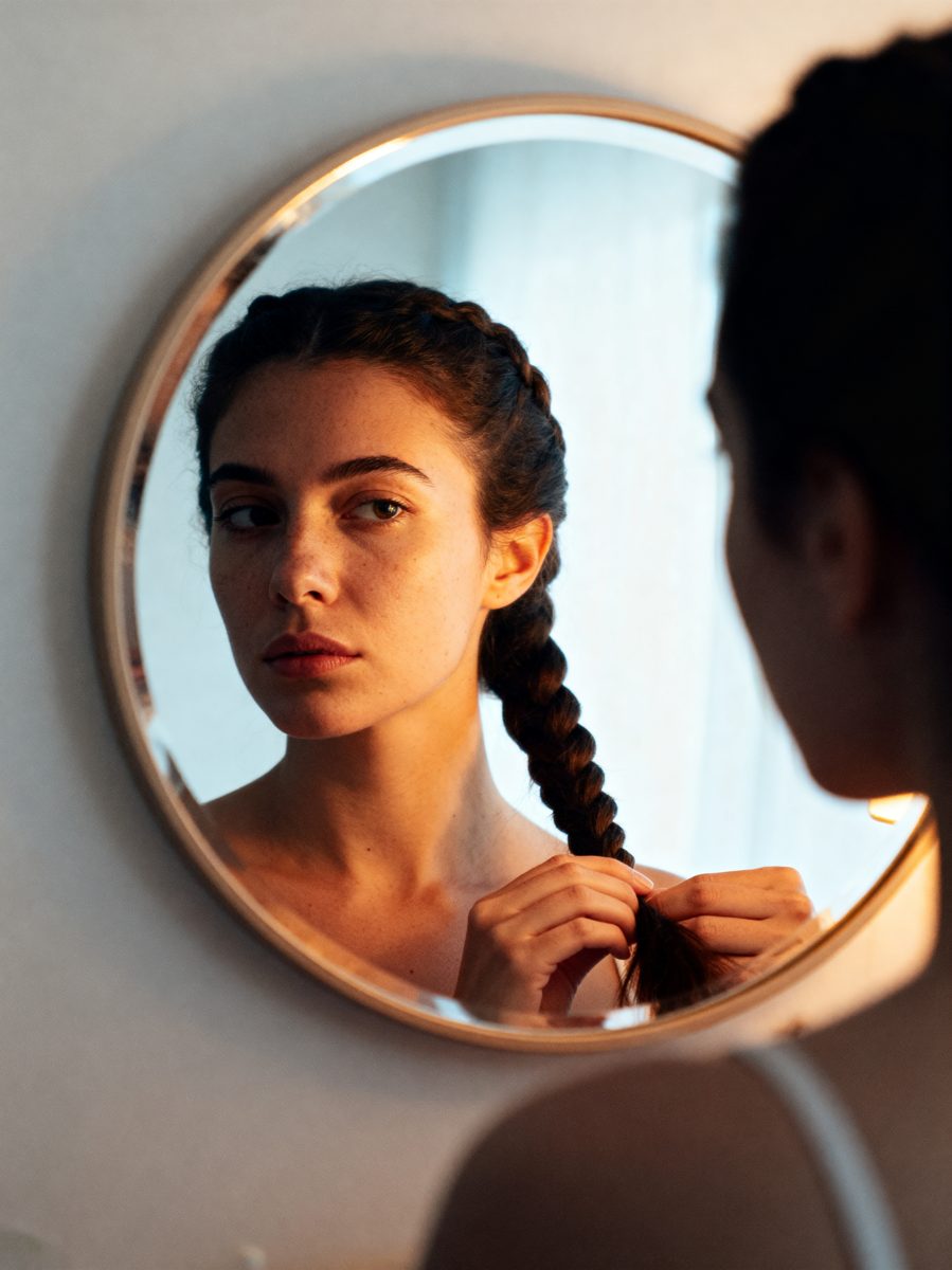 Braiding Hair at Mirror